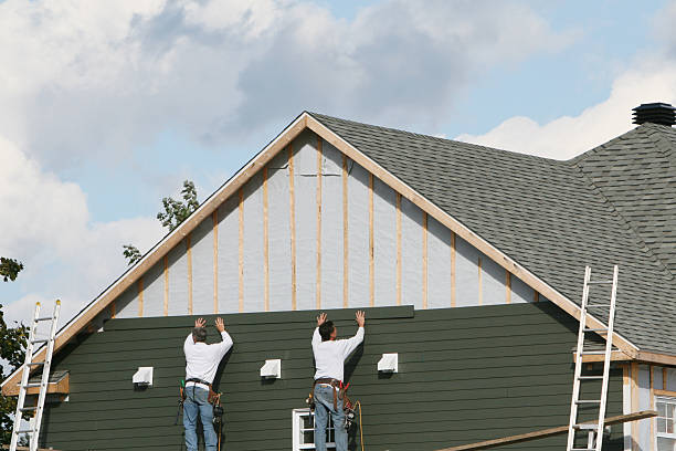 Professional Siding technician working in Onley, VA